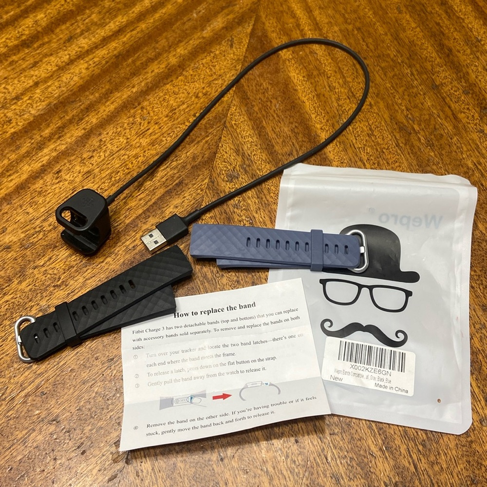 Fit Bit Charge 3. Charger and 2 new replacement bands
